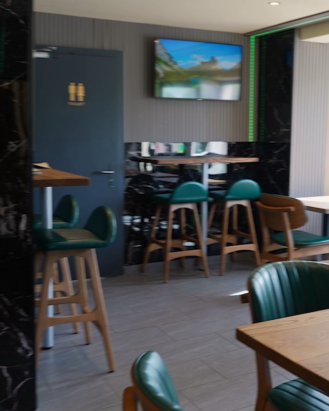 Restaurant with glazed terrace, Lausen BL — High tables with bar stools (Still from video)
