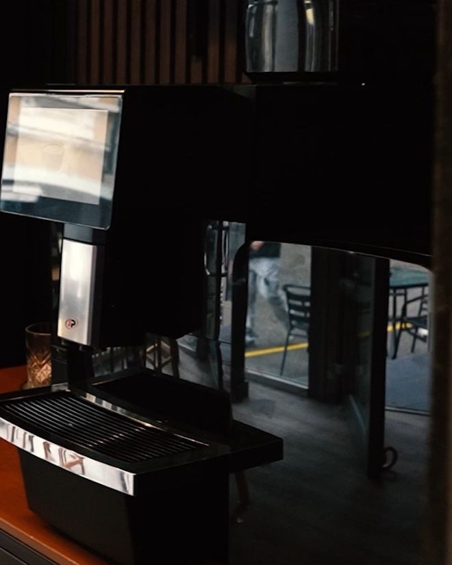 Pizza and burger restaurant, Olten SO — Coffee station against the slatted wall (Still from video)